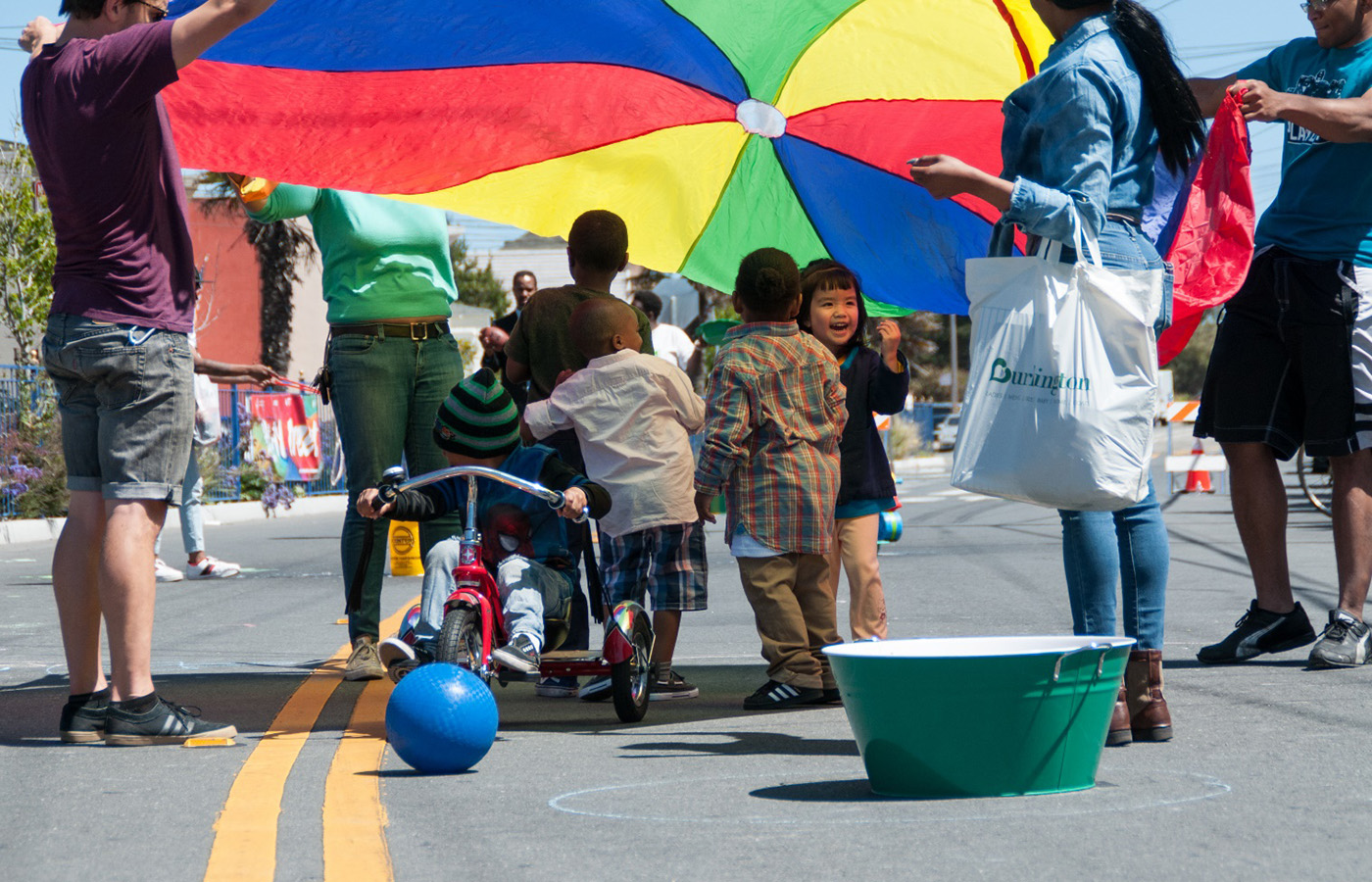 Image of families playing in the street. Photo Credit: SFMTA Photo.